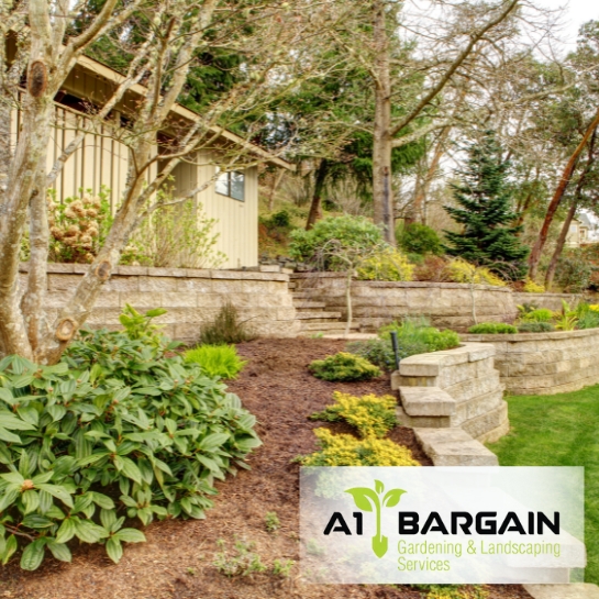 Expert Retaining Wall Repair for Long Lasting Strength: Well-maintained stone retaining walls with lush landscaping.