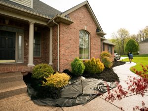 Mulch alternatives used in front yard landscaping, showing installation for moisture retention and weed control.