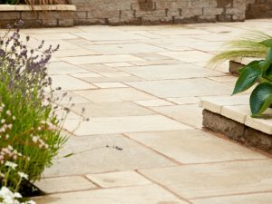 DIY paving project with neatly arranged paving stones in a backyard, showcasing a simple, stylish outdoor design.