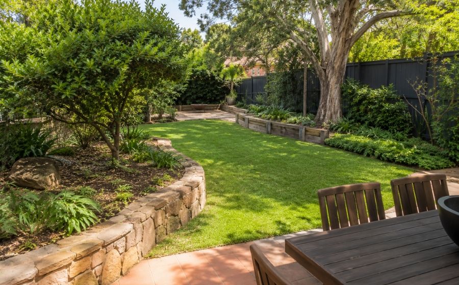 Backyard transformation with paving, lawn and garden beds in Burwood